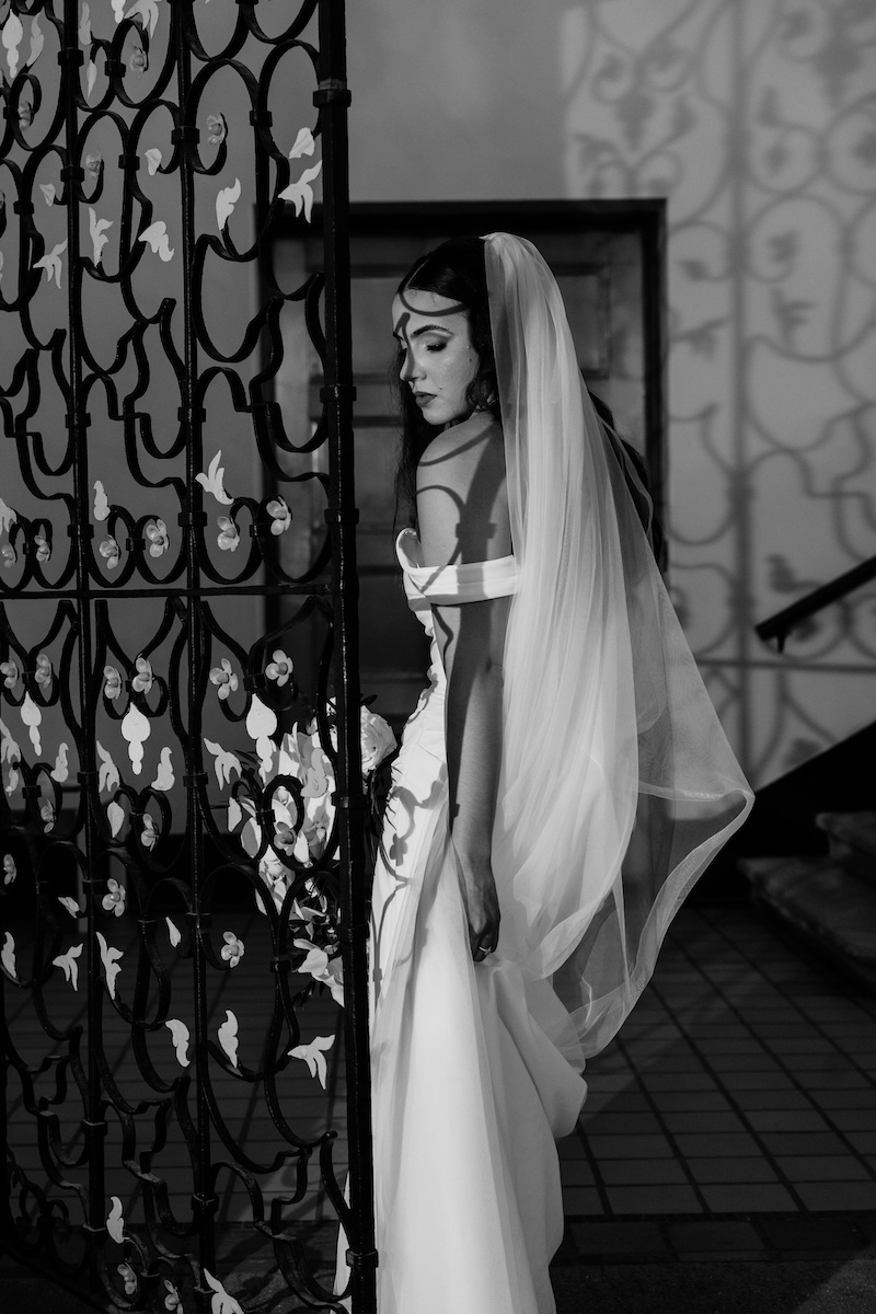 Timeless film bridal portrait set against the historic Deering Estate in Florida